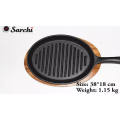 cast iron skillet sizzling plate with vegetable oil coating fajita pan